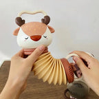 Hochet accordéon – figurine animal avec poignées et sons